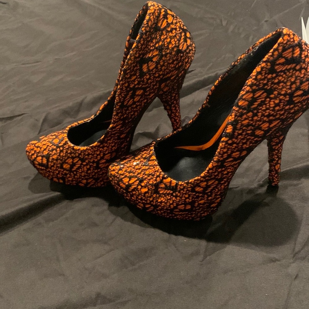 Shiekh design. Orange and black. Size 7 1/2.